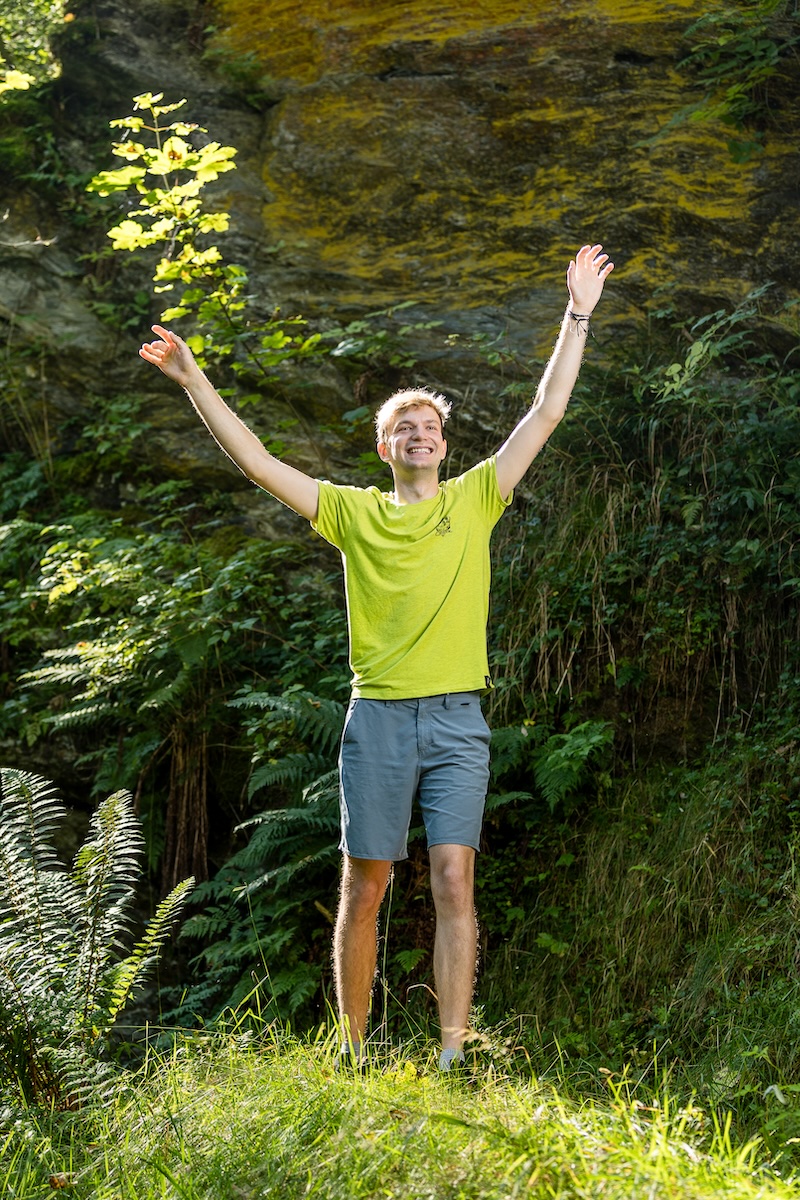 Julian smiling for the camera in the forest near Innsbruck.