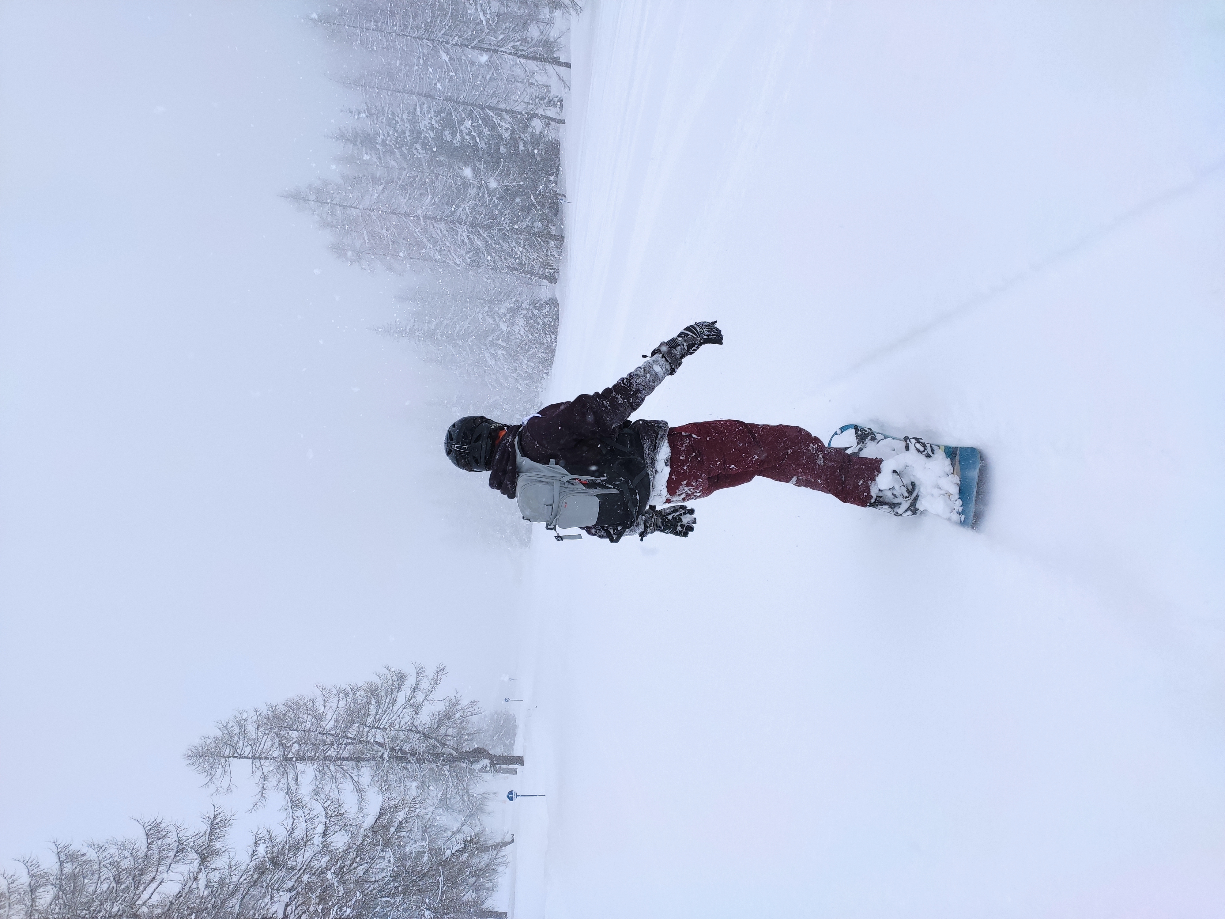 Julian snoboarding into the white-out at Schlick.